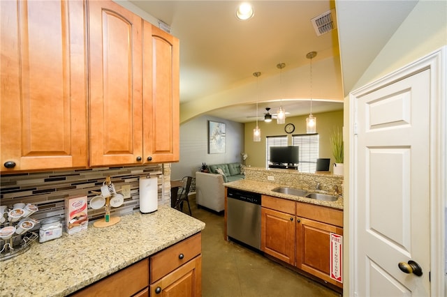 kitchen with backsplash, light stone countertops, hanging light fixtures, sink, and stainless steel dishwasher