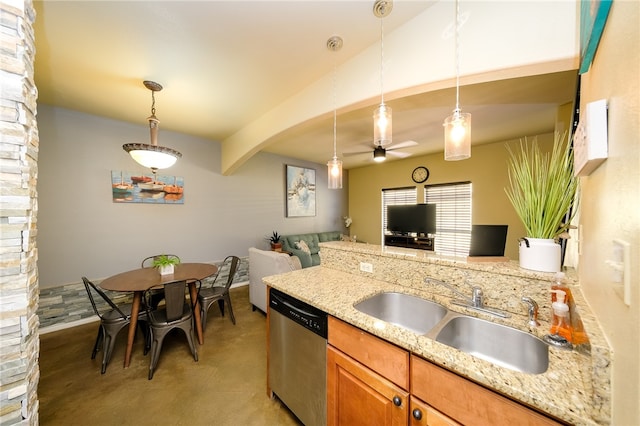 kitchen featuring stainless steel dishwasher, light stone countertops, hanging light fixtures, and sink