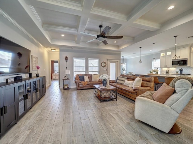 living area with plenty of natural light and light wood finished floors