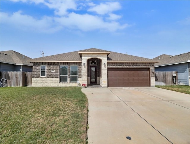 view of front of house featuring a garage, a front yard, brick siding, and fence