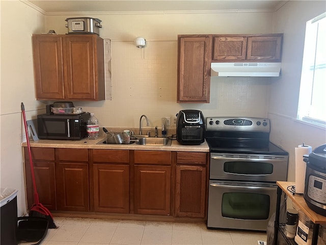 kitchen featuring stainless steel electric range, sink, and ornamental molding