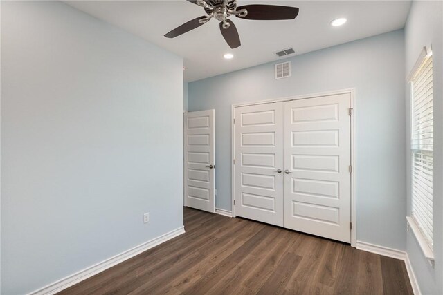 113 Knickerbocker St, Corpus Christi, TX 78418 - unfurnished bedroom with dark wood finished floors, baseboards, a closet, recessed lighting, and ceiling fan