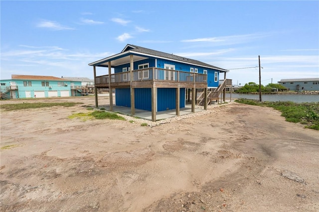 113 Knickerbocker St, Corpus Christi, TX 78418 - rear view of property with a wooden deck and stairway