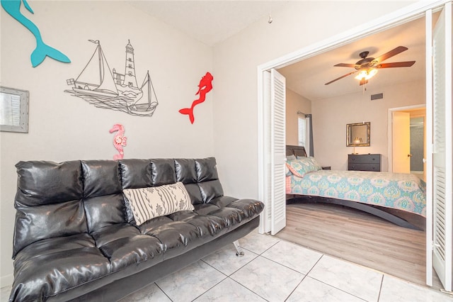 bedroom with wood-type flooring and ceiling fan