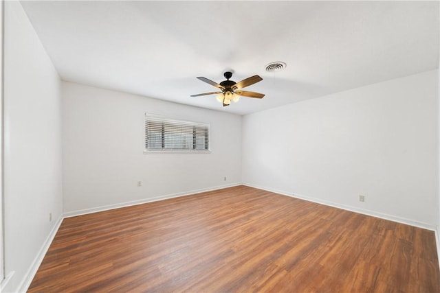 445 Poenisch, Corpus Christi, TX 78412 - spare room with wood finished floors, ceiling fan, and baseboards