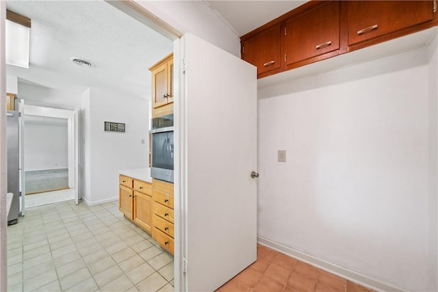 445 Poenisch, Corpus Christi, TX 78412 - kitchen with light countertops, baseboards, and light tile patterned floors