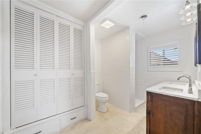 445 Poenisch, Corpus Christi, TX 78412 - bathroom featuring a closet, toilet, double vanity, and tile patterned floors