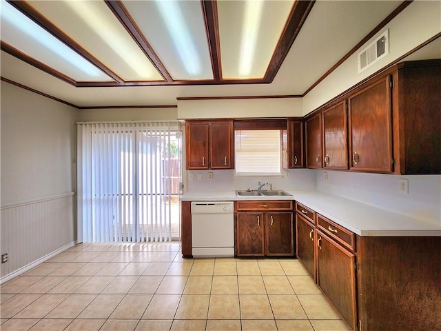 kitchen featuring ornamental molding, white dishwasher, sink, and light tile patterned floors