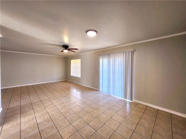 empty room featuring ornamental molding, light tile patterned floors, a textured ceiling, and ceiling fan