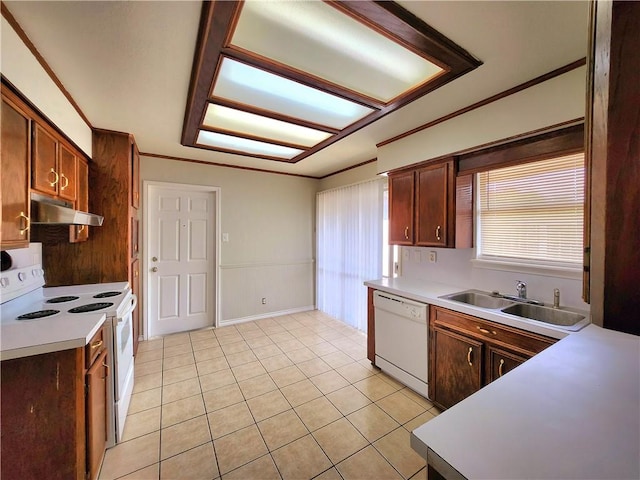 kitchen with crown molding, sink, white appliances, and light tile patterned flooring