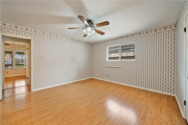 13341 Scenic Cir, Corpus Christi, TX 78410 - unfurnished room featuring light wood finished floors, ceiling fan, and wallpapered walls