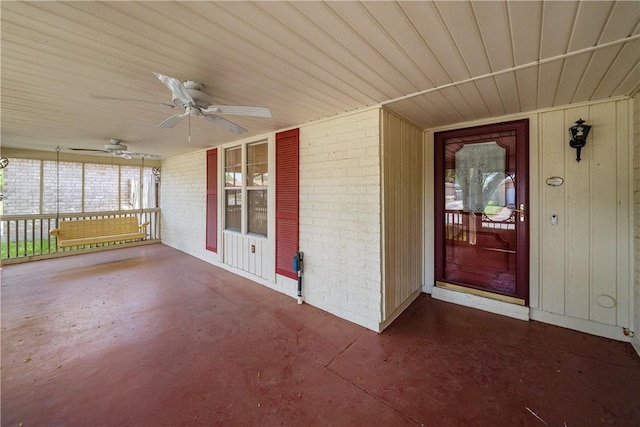 13341 Scenic Cir, Corpus Christi, TX 78410 - property entrance featuring brick siding, a ceiling fan, and a porch