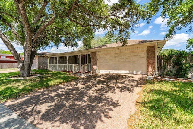 13341 Scenic Cir, Corpus Christi, TX 78410 - ranch-style house with brick siding, driveway, and a sunroom