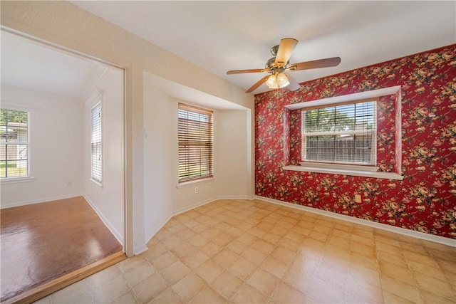 13341 Scenic Cir, Corpus Christi, TX 78410 - unfurnished room with plenty of natural light, a ceiling fan, and light flooring
