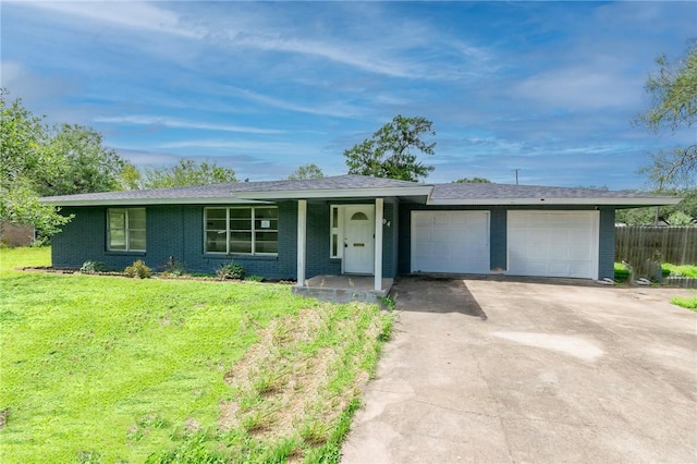 704 E Henderson St, Bishop, TX 78343 - ranch-style house with an attached garage, concrete driveway, and brick siding