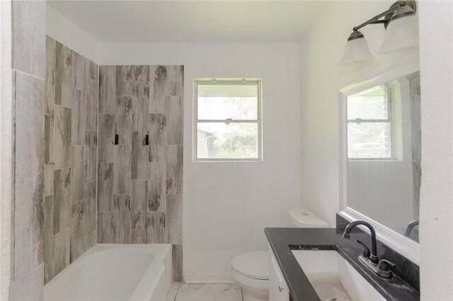 704 E Henderson St, Bishop, TX 78343 - bathroom with vanity, marble look tile flooring, and  shower combination