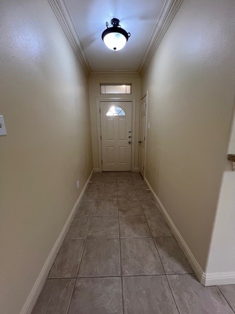 entryway featuring ornamental molding and tile patterned floors