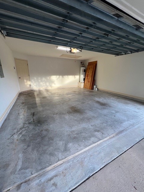 garage featuring a garage door opener and secured water heater