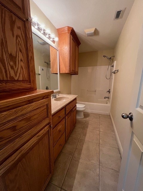 full bathroom with shower / bathing tub combination, vanity, tile patterned floors, and toilet