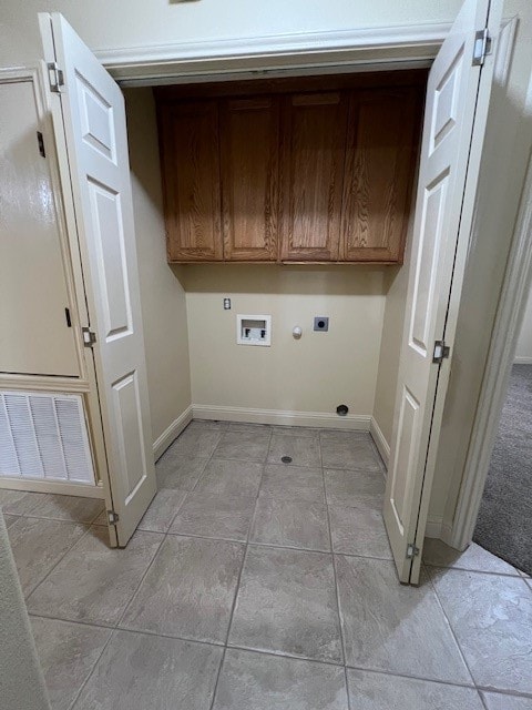 washroom featuring washer hookup, cabinets, hookup for a gas dryer, and hookup for an electric dryer