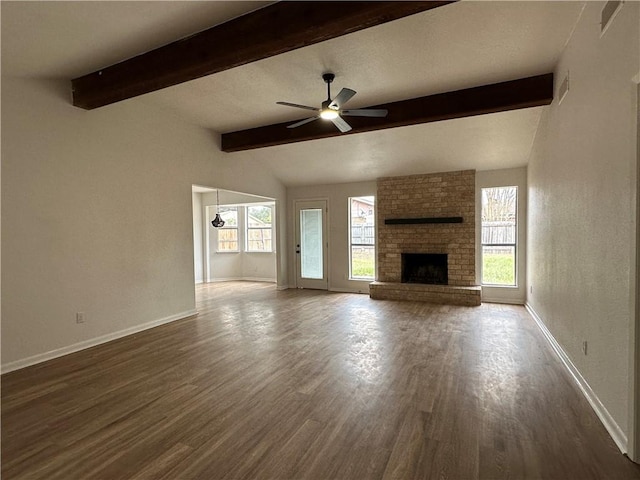 6118 Locke, Corpus Christi, TX 78415 - unfurnished living room featuring dark wood-type flooring, ceiling fan, and a brick fireplace