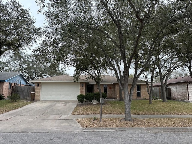 6118 Locke, Corpus Christi, TX 78415 - ranch-style home with brick siding, an attached garage, and concrete driveway