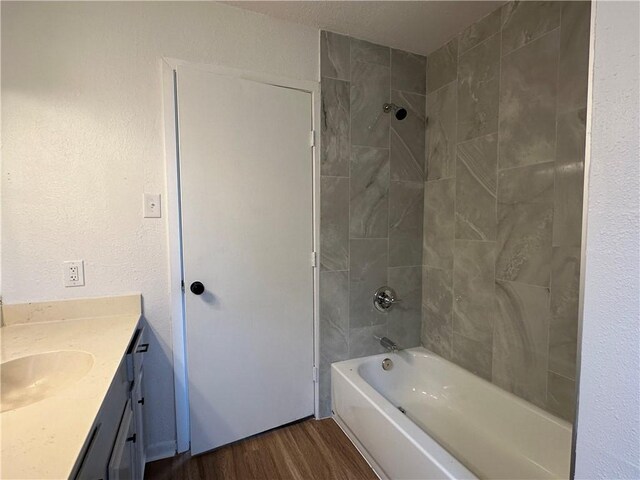 6118 Locke, Corpus Christi, TX 78415 - full bath featuring vanity, wood finished floors, and washtub / shower combination
