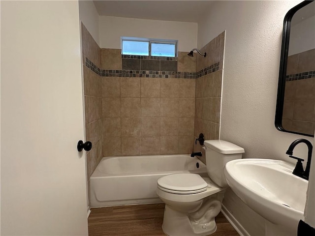 6118 Locke, Corpus Christi, TX 78415 - bathroom with wood finished floors and tub / shower combination