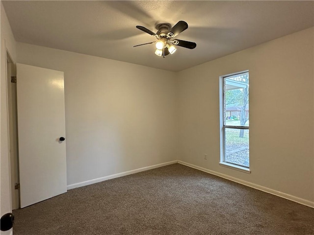 6118 Locke, Corpus Christi, TX 78415 - empty room featuring dark carpet and a ceiling fan