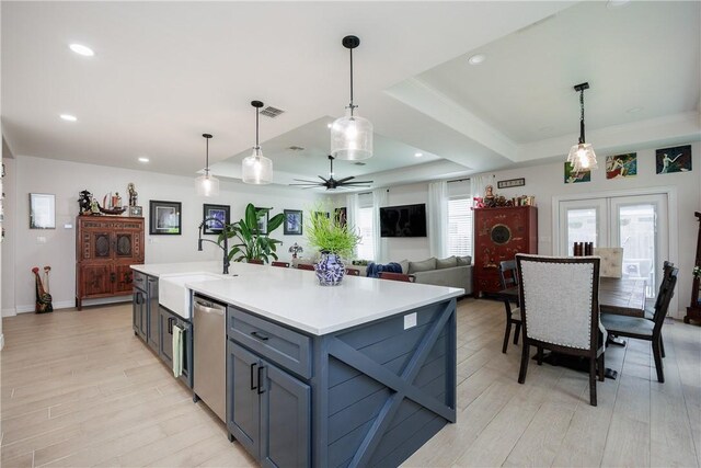 4101 Karo Dr, Corpus Christi, TX 78414 - kitchen featuring light wood-style floors, light countertops, stainless steel dishwasher, and recessed lighting