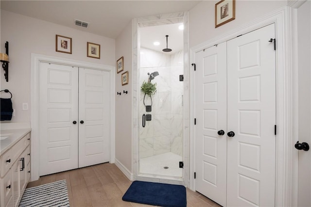 4101 Karo Dr, Corpus Christi, TX 78414 - full bath with a marble finish shower, vanity, and wood finished floors