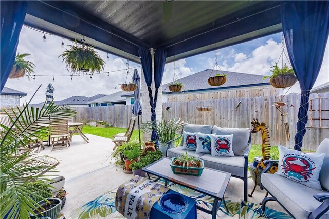 4101 Karo Dr, Corpus Christi, TX 78414 - fenced backyard featuring outdoor lounge area, a patio, and outdoor dining space
