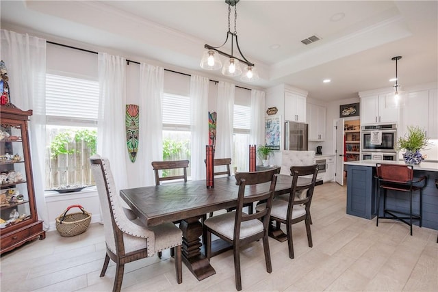 4101 Karo Dr, Corpus Christi, TX 78414 - dining room featuring a tray ceiling, recessed lighting, crown molding, and light wood finished floors