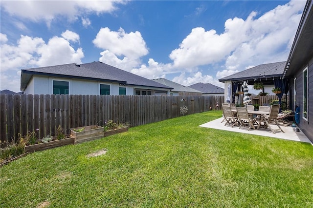4101 Karo Dr, Corpus Christi, TX 78414 - fenced backyard featuring a vegetable garden and a patio area