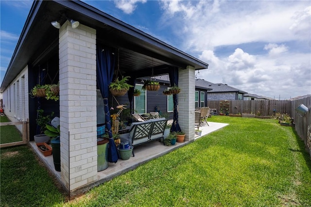4101 Karo Dr, Corpus Christi, TX 78414 - view of side of home with a patio and a fenced backyard