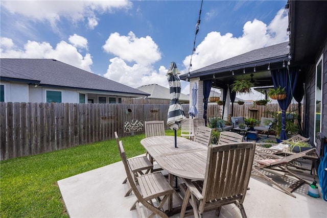 4101 Karo Dr, Corpus Christi, TX 78414 - fenced backyard with a patio area and outdoor dining area