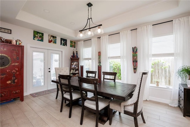 4101 Karo Dr, Corpus Christi, TX 78414 - dining room featuring a tray ceiling, french doors, and light wood finished floors