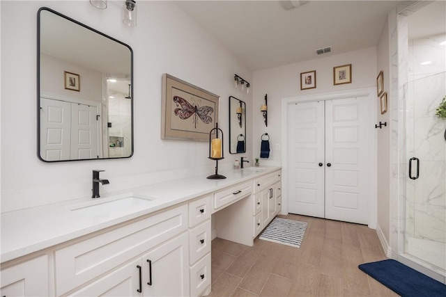 4101 Karo Dr, Corpus Christi, TX 78414 - full bathroom featuring a marble finish shower and double vanity