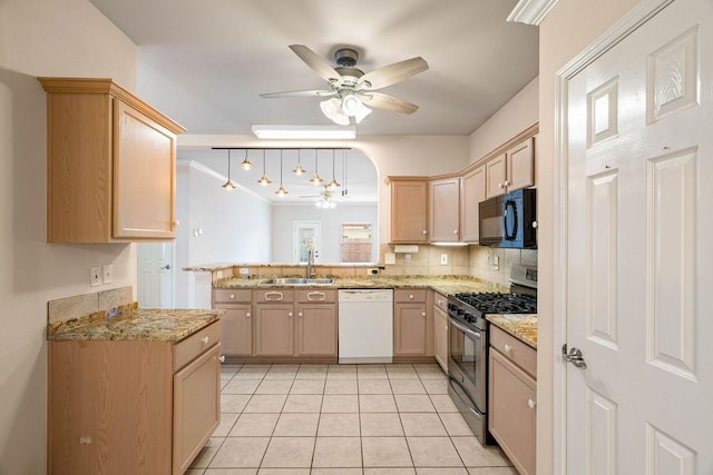 kitchen featuring stainless steel range with gas cooktop, ceiling fan, black microwave, dishwasher, and a sink