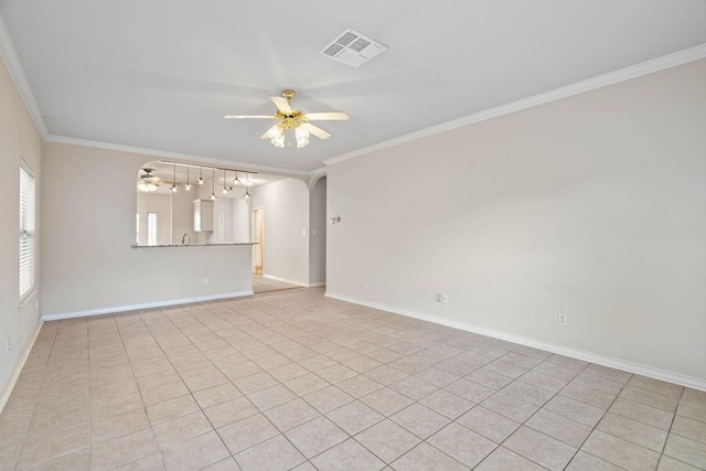 spare room with visible vents, ceiling fan, and ornamental molding