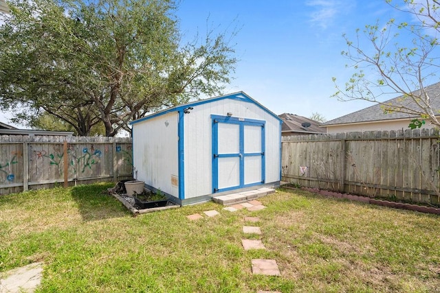 view of shed with a fenced backyard