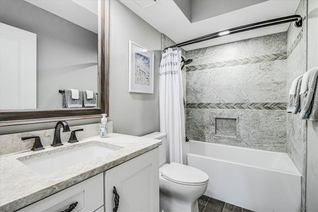 bathroom with vanity, shower / bath combo, toilet, and wood finished floors