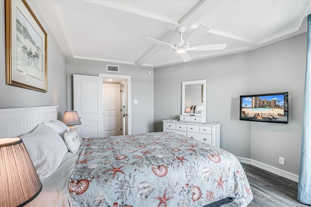 bedroom featuring a ceiling fan, baseboards, wood finished floors, visible vents, and coffered ceiling