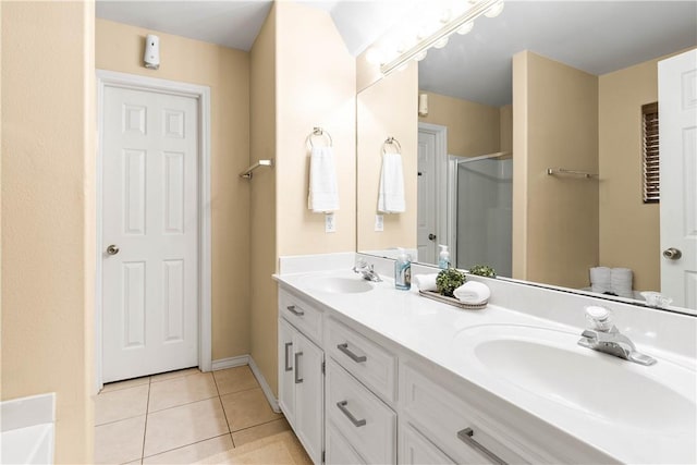 3837 Brockhampton Ct, Corpus Christi, TX 78414 - bathroom with a shower stall, double vanity, tile patterned floors, and a bathtub