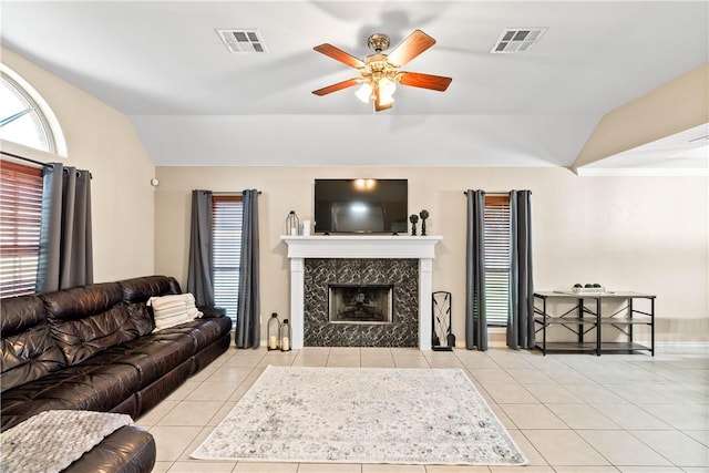 3837 Brockhampton Ct, Corpus Christi, TX 78414 - living room featuring lofted ceiling, tile patterned flooring, healthy amount of natural light, ceiling fan, and a premium fireplace