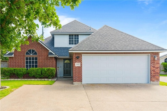 3837 Brockhampton Ct, Corpus Christi, TX 78414 - traditional home with driveway, a shingled roof, brick siding, and a garage