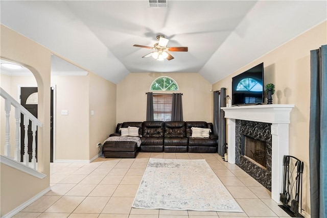3837 Brockhampton Ct, Corpus Christi, TX 78414 - living room with ceiling fan, a fireplace, light tile patterned flooring, vaulted ceiling, and stairway