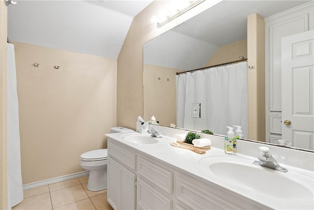 3837 Brockhampton Ct, Corpus Christi, TX 78414 - bathroom with vaulted ceiling, double vanity, and tile patterned floors