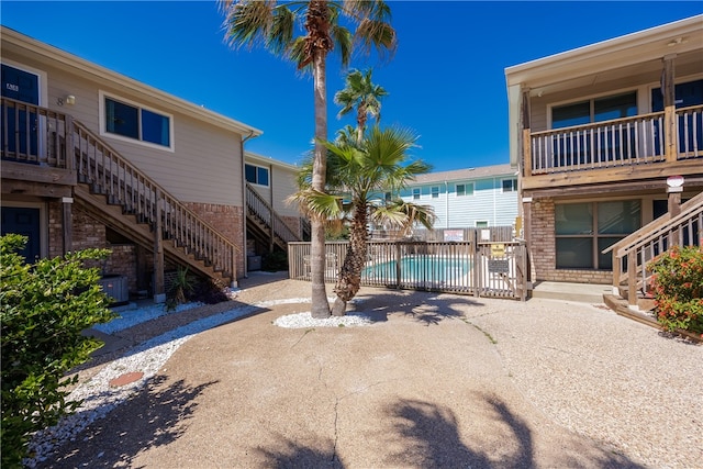 exterior space with a patio area and a pool