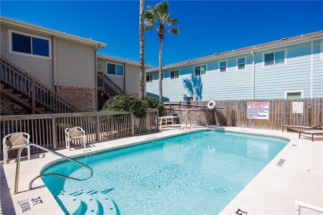 view of swimming pool with a patio